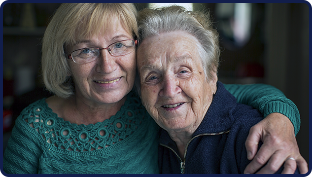 Image20250211110919 Two elderly women smiling after receiving assistance from Tucker Disability Law, representing satisfied clients.